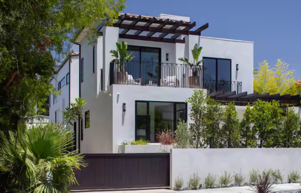 Casa Luna exterior with balcony and palm trees